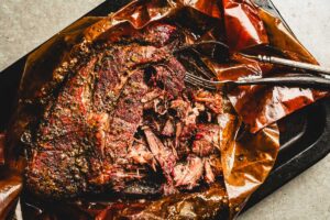 Smoked Chuck Roast shredded on a sheet pan