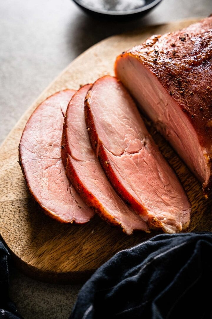 Perfect pork tenderloin sliced on a cutting board