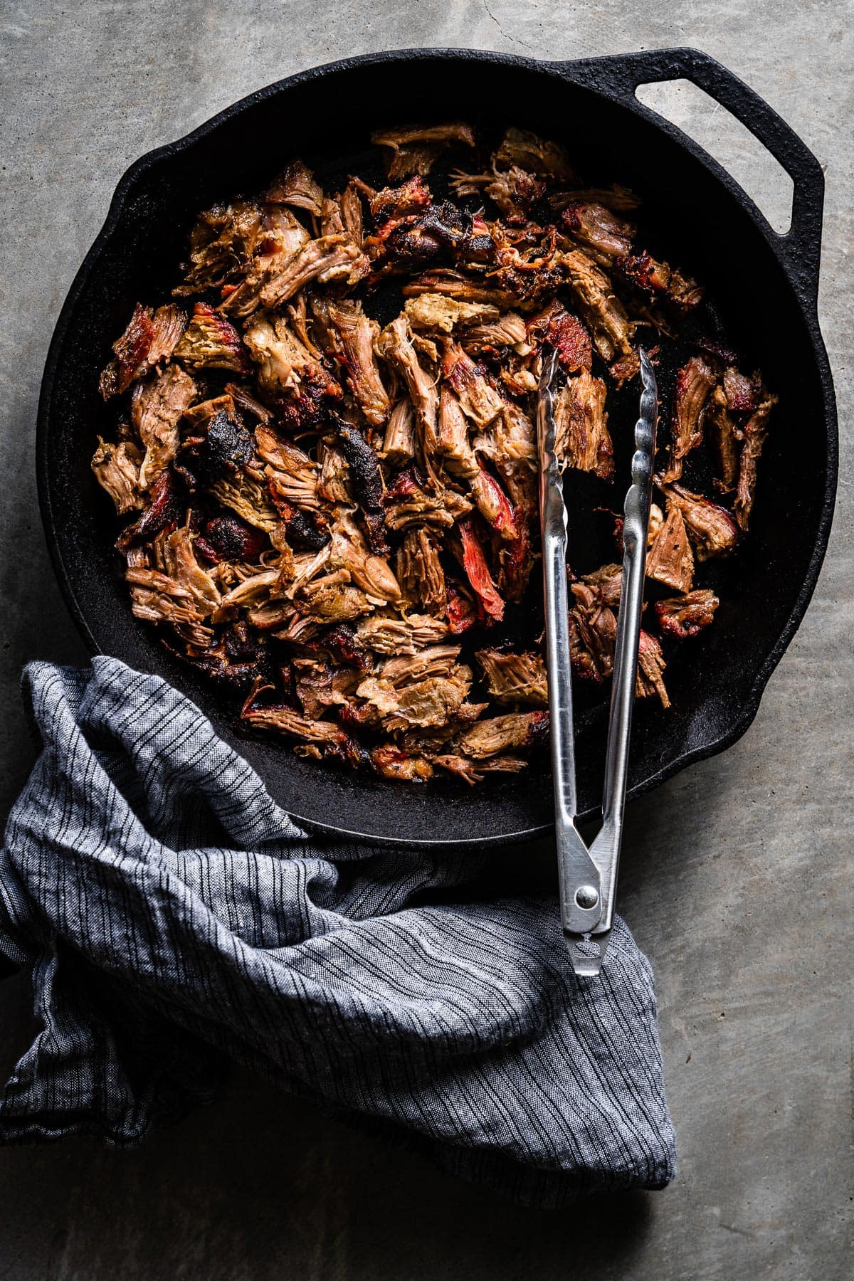 smoked pulled lamb shoulder in skillet