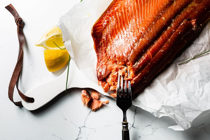 smoked salmon on cutting board with lemon