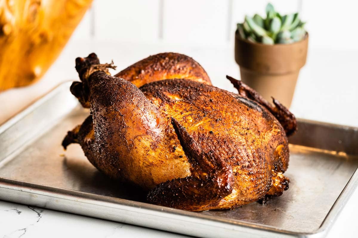 Smoked whole chicken on a sheet pan horizontal