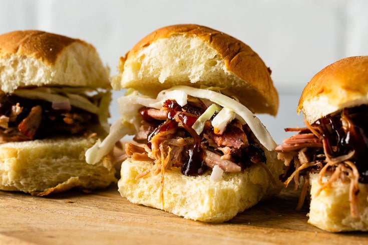 smoky sous vide pulled pork sliders in a row