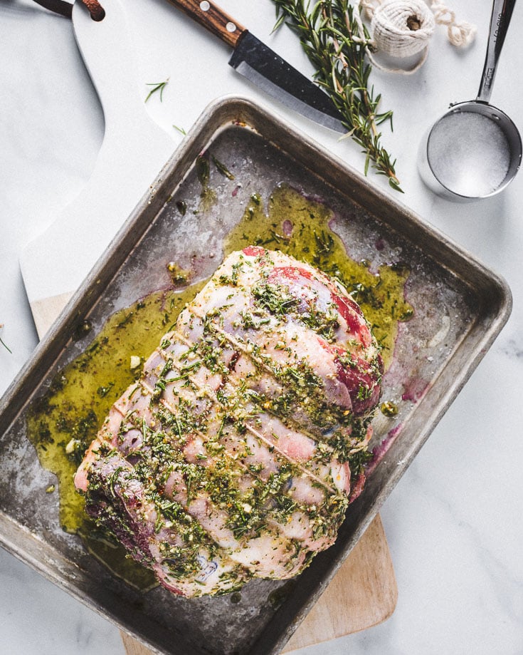 sous vide leg of lamb marinating on sheet pan overhead