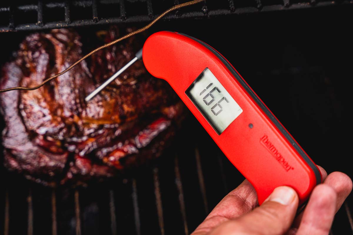 thermapen thermometer checking temp of smoked lamb shoulder