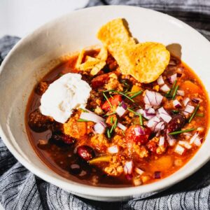 turkey chili with toppings in bowl horizontal