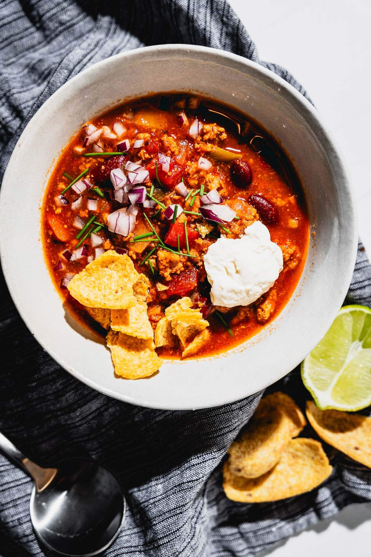 turkey chili with toppings in bowl overhead