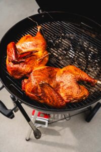 turkey on the grill with thermometer