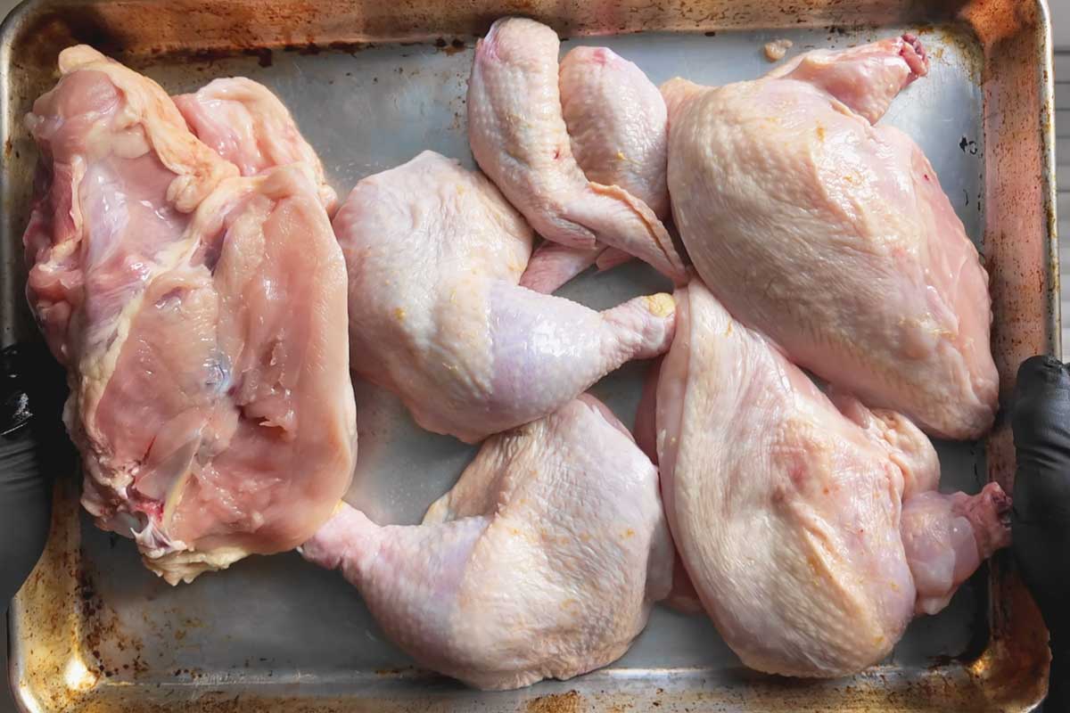 A Whole Chicken Cut Up on a Sheet Pan