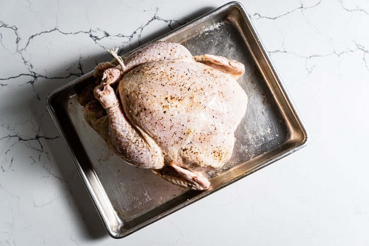 whole chicken on sheet pan for roasting